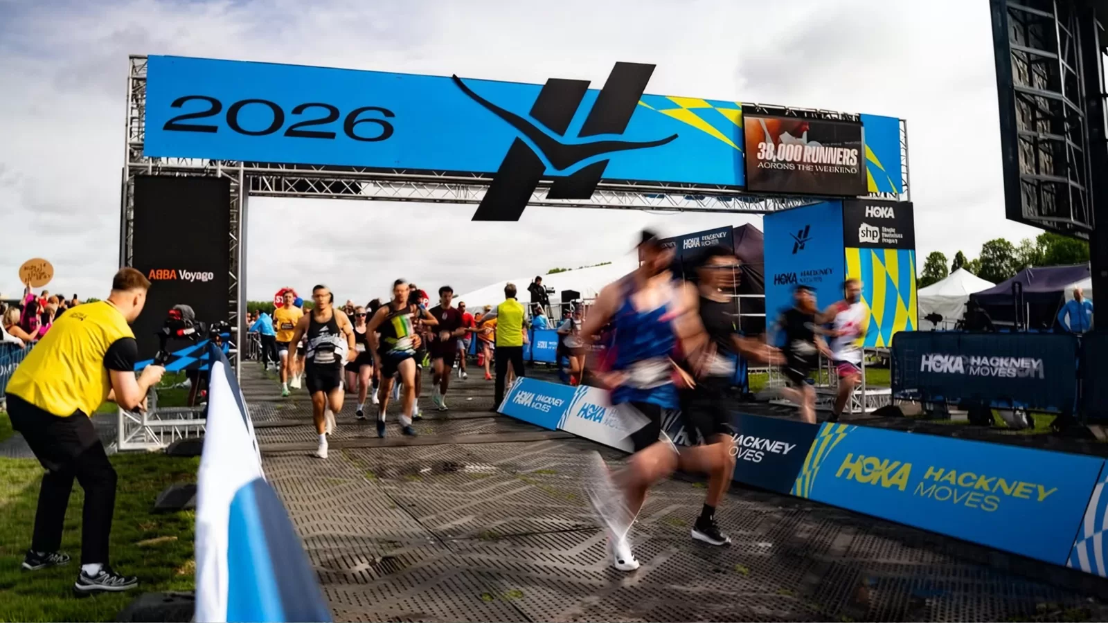 Runners crossing the 2026 finish gantry