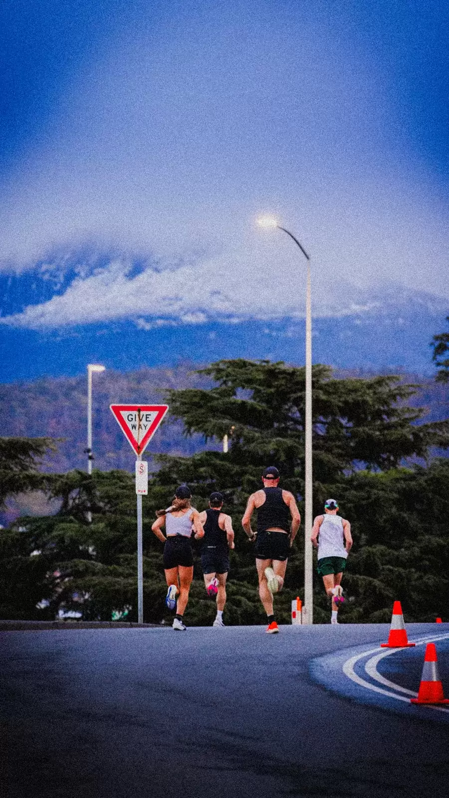 Runners on the road below Mount Wellington