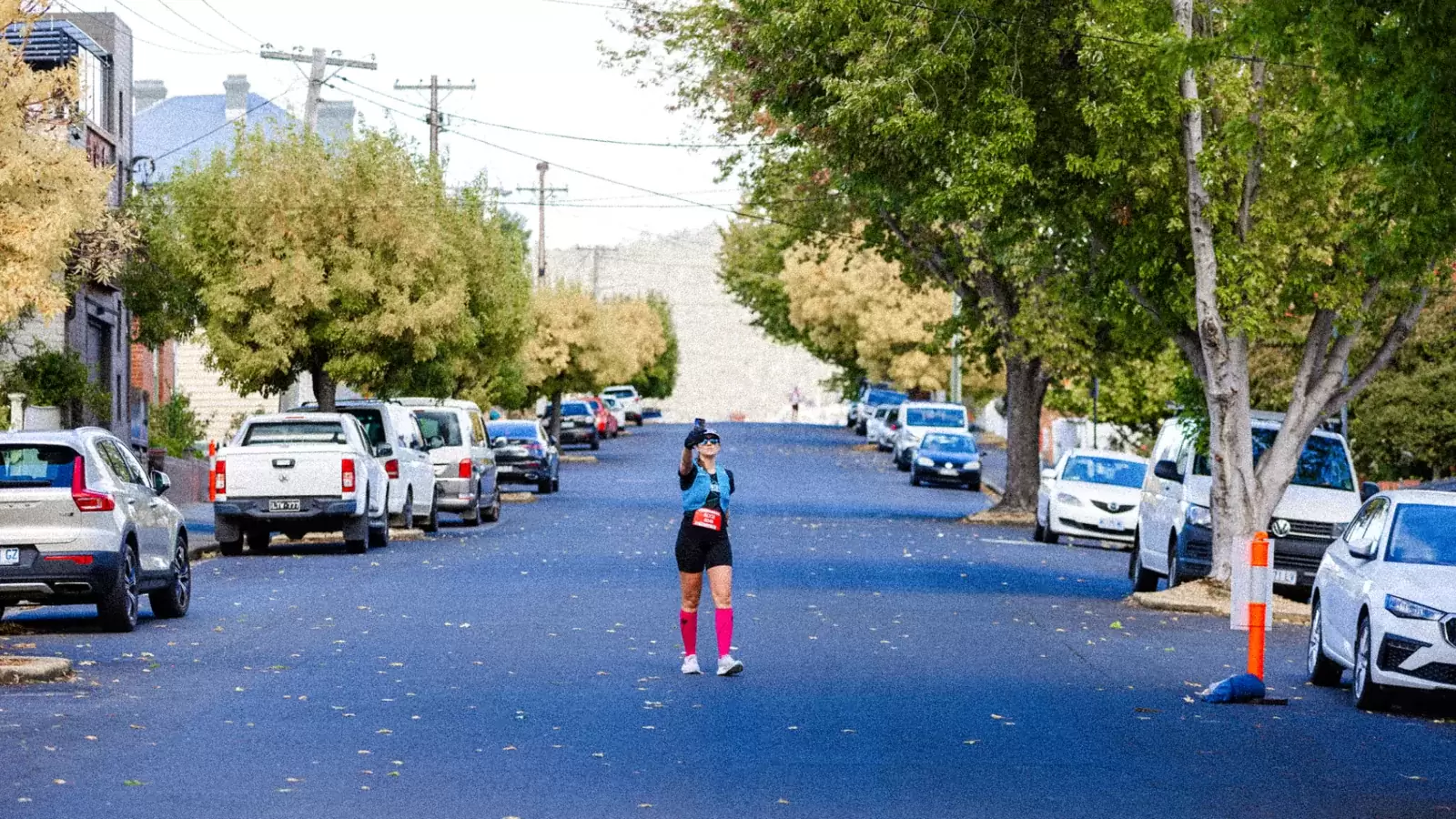 Runner on a tree-lined Hobart street